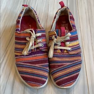 Tom’s striped tennis shoes. Size 8